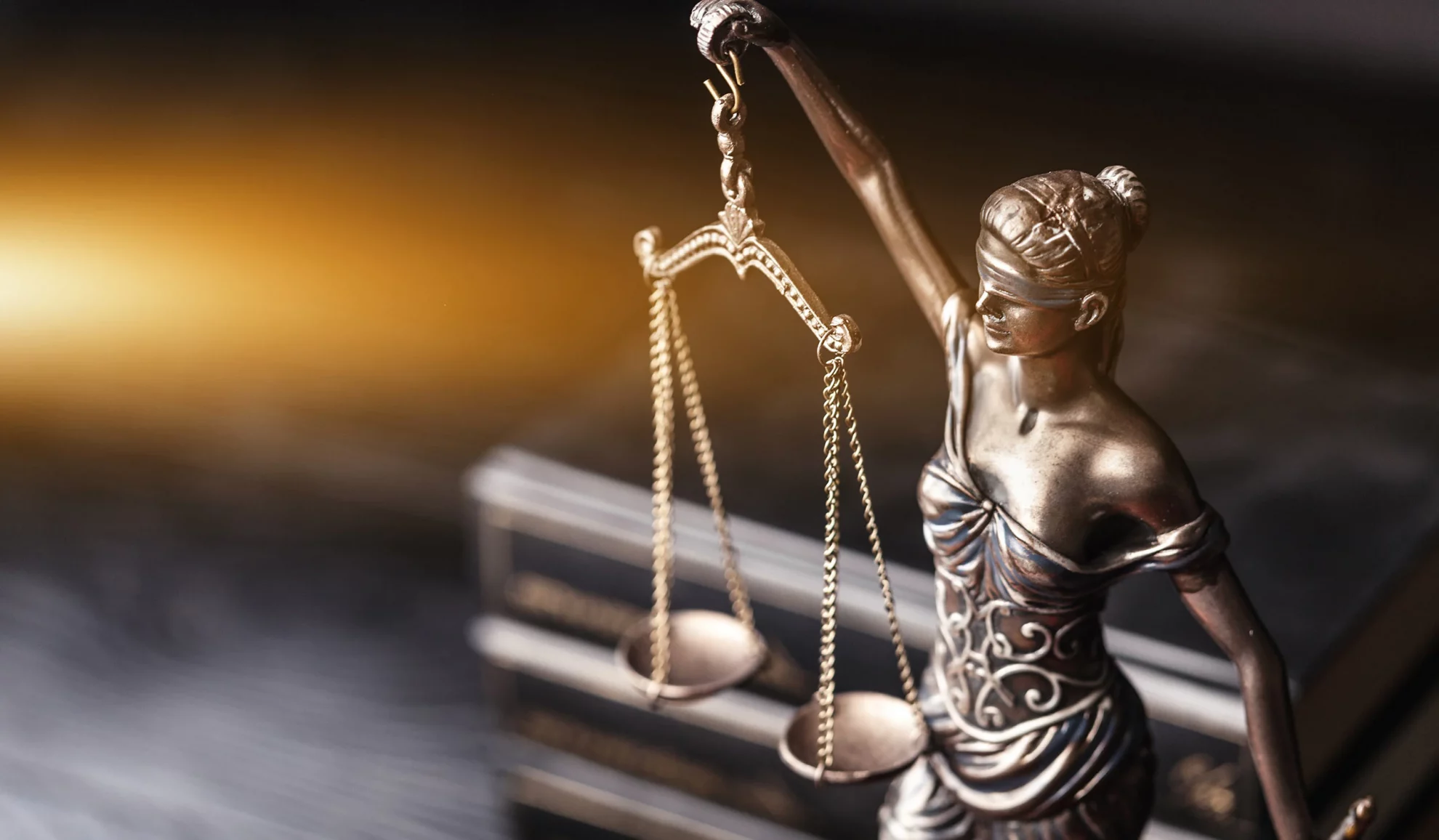 lady justice law figurine on lawyers desk